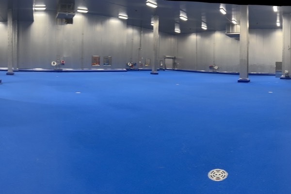 SaniCrete blue flooring in seafood processing facility