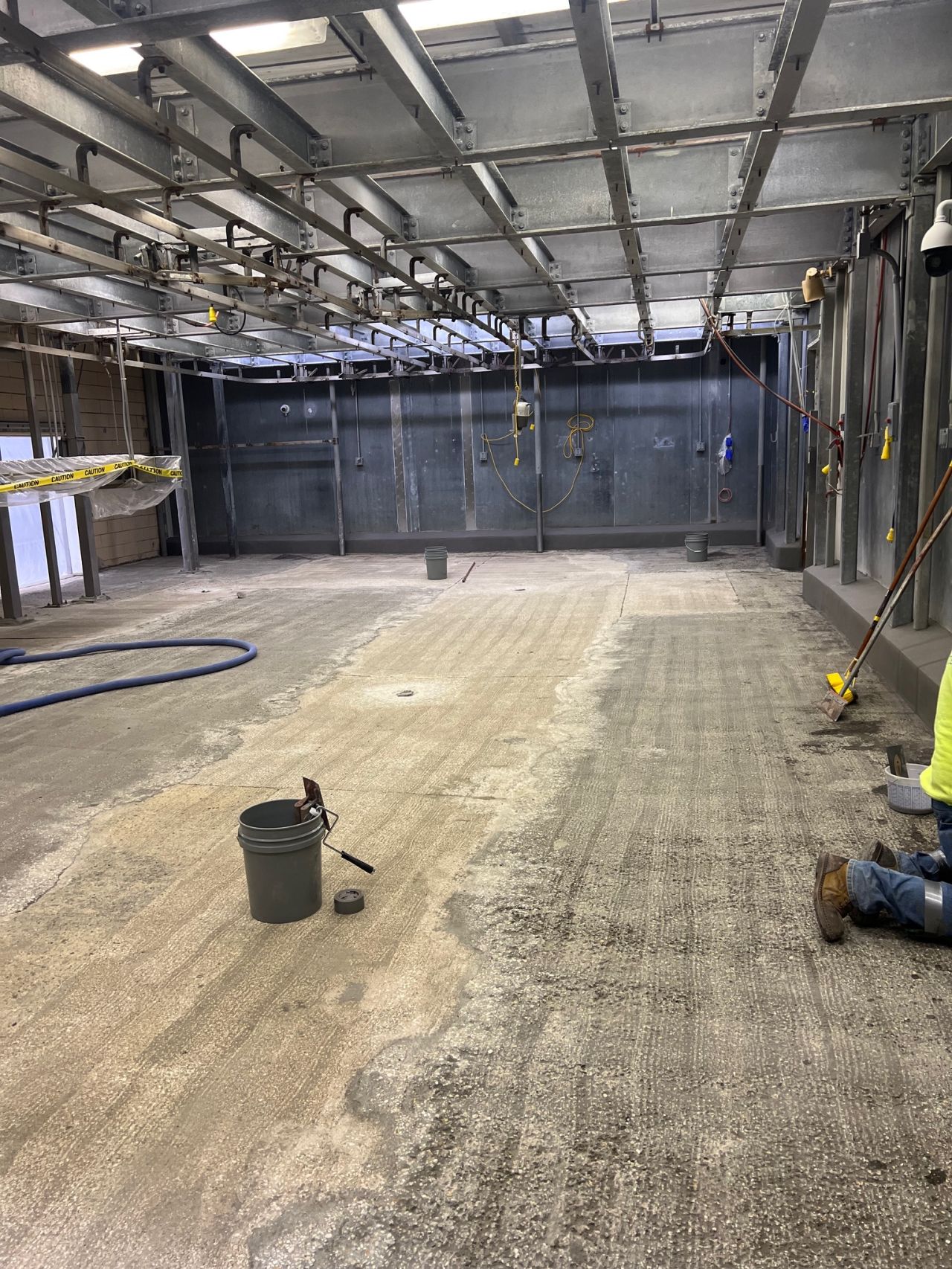 Scarified concrete substrate prepared for new flooring installation with proper slope correction