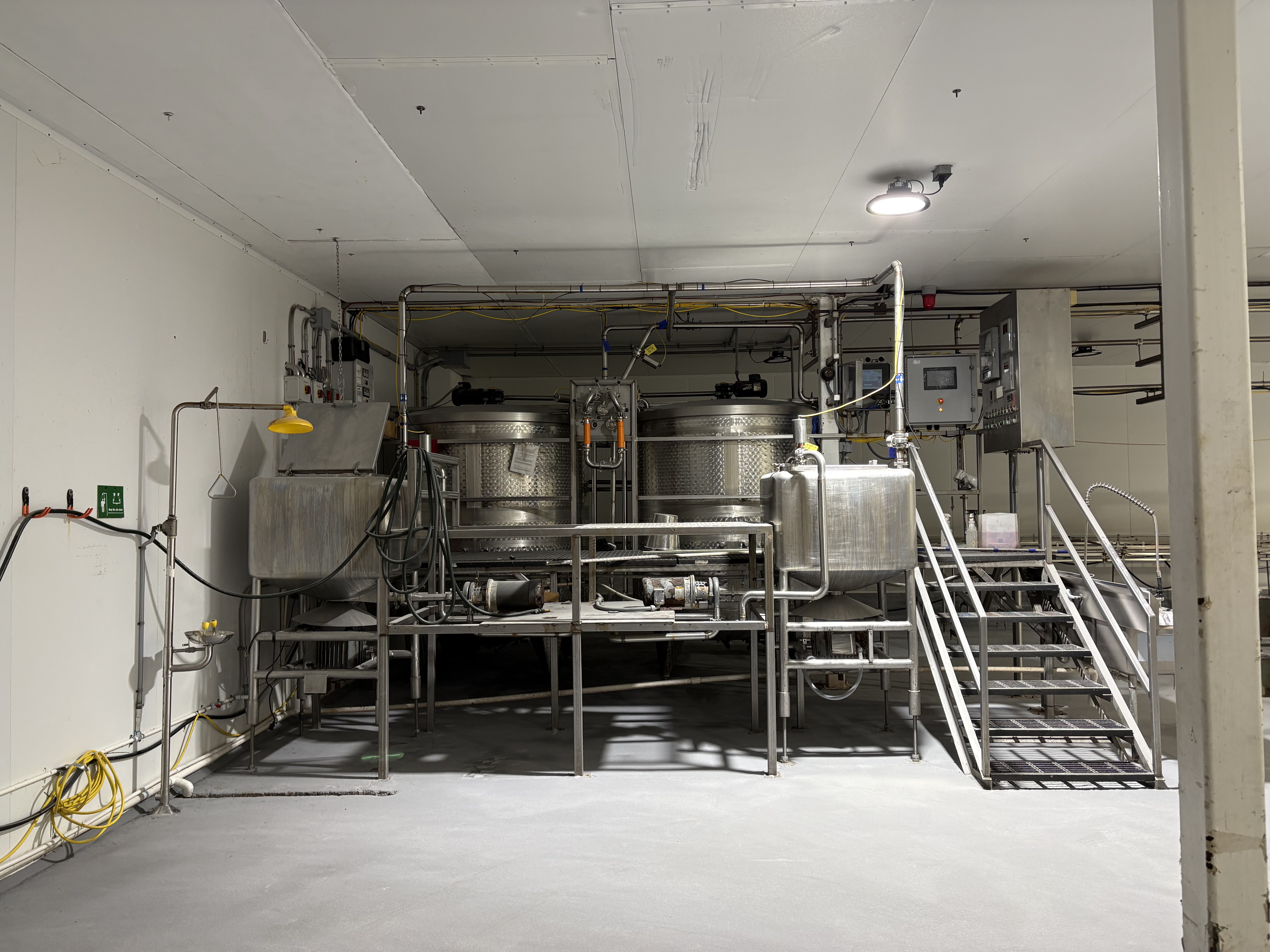 Finished processing area with stainless steel equipment and new SaniCrete floor