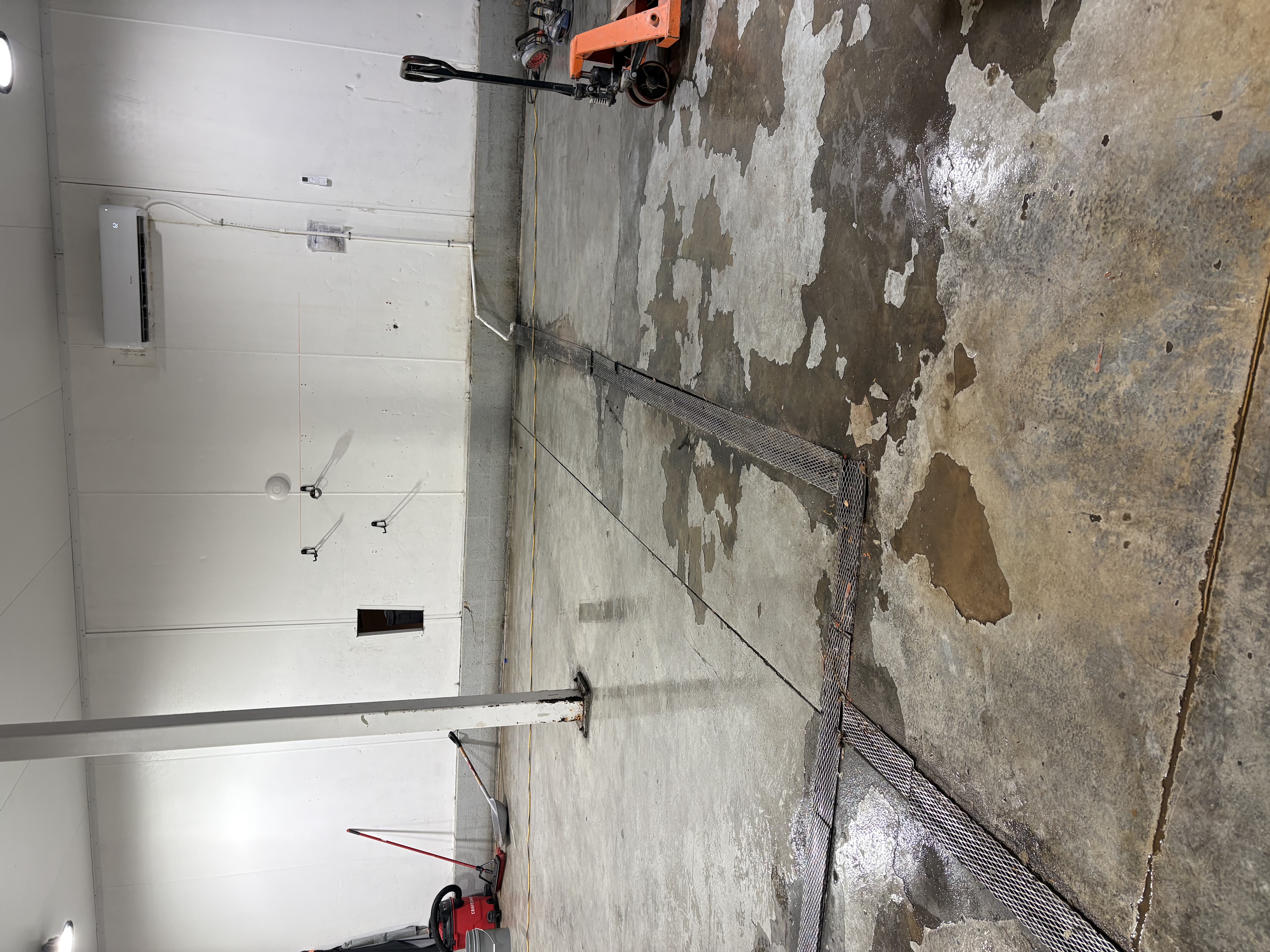 Close-up of damaged bottling floor before renovation