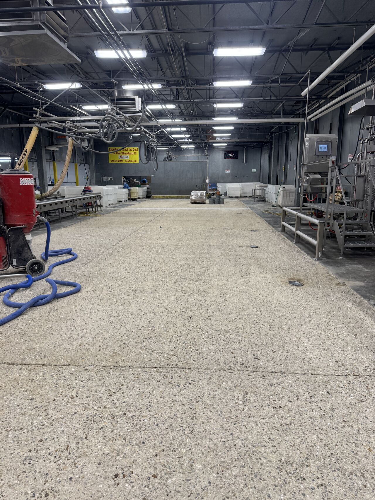 Profiled concrete substrate ready for SaniCrete STX installation with vacuum equipment